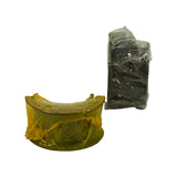 Side-on view of both bearing packages: flanged thrust bearing (yellow wrap, left) showing flange/tang clearly; standard journal bearing stack (clear wrap, right) showing dark overlay lining on inner face and copper-lead lining on back.