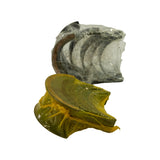 Alternate angle of same two wrapped packages. Thrust bearing flange visible through yellow poly; inner face (grey babbitt/overlay surface) of journal shells visible through clear wrap.