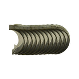 Shell set viewed from bore-facing side in stacked fan arrangement. Copper-toned steel back visible along outer rim edges. Original clear protective film wrap intact over all 12 shells. Consistent with a 6-cylinder full set of upper and lower halves.