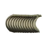 Bore-face view from opposite side to photo 3. Polished silver-tone bearing surface visible on each of the 12 shells. Oil hole visible on at least one upper shell. Shells appear uninstalled and unused with original anti-corrosion coating present.