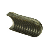 Three-quarter angle view from opposite end to photo 6. Bore-face surface and shell edge profile visible. Polished bearing surface consistent across all shells. No stampings or markings visible from this angle.