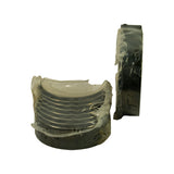 Upper half-shells stacked vertically showing inner bearing face (AluminumSilicon overlay visible) and outer steel back. Separate edge-on view of lower halves showing uniform thickness and steel backing.