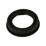Close-up angled view of seal interior showing garter spring coil seated in groove on the primary sealing lip. Outer flanged rubber body visible with yellow-green band on OD.