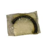 Contents inside unsealed inner poly bag viewed from front: a single semicircular moulded rubber seal half laid flat, dark black/charcoal colour, roughly D-shaped profile, with a wavy sealing lip visible along the inner diameter edge.