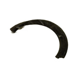 Bare seal half removed from inner bag, displayed against white background. Semicircular form, black moulded rubber, ribbed outer sealing surface with two or three sealing lips visible in cross-section at the ends.