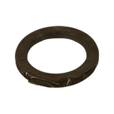 Three-quarter elevated angle showing the seal's cross-sectional profile and overall thickness. Dark brown rubber body; one edge of polybag remains attached at bottom of seal. Slight sheen from factory lubrication on sealing lip area.