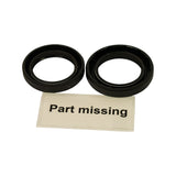 Underside view of both seals showing garter/coil springs visible on the sealing lips of both pieces, confirming spring-loaded lip seal construction. 'Part missing' card present.