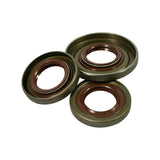 Three-quarter angled view of the seal set. Inner lip spring coils clearly visible on all three. Depth profile shows shallow profile typical of alternator drive-end shaft seals. Stamped marking '30x43' partially legible on one seal rubber face.