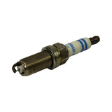 Angled view of spark plug showing firing end with ground electrode, hex body, and partial text on hex reading what appears to be part number. Thread and gasket seat clearly visible.