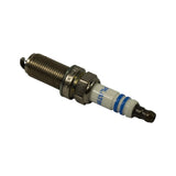 Angled view from terminal end showing 'PLATINA' text on insulator, blue identification stripe, SAE terminal post, and ground electrode with fired-end detail.