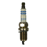 Front-on close-up of spark plug showing full length: dark suppressor cap terminal at top, white ceramic insulator body with BOSCH logo and partial part number, nickel hex, yellow gasket ring, M14 threaded shell, and hooked J-gap ground electrode at firing end. Part number FR8LI332S and GERMANY visible stamped on shell.