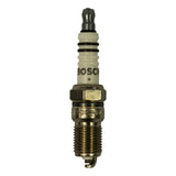 Close-up front view of spark plug showing white alumina ceramic insulator with 'BOSCH +' markings, hex nut, threaded steel shell with 'HR6DC+-RU' stamped on flat, and bent J-hook ground electrode at firing tip.