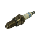 Three-quarter angled view of full plug, showing threaded body, hex nut, stepped insulator with blue Bosch ring, and removable SAE terminal nut at top. Triple ground electrode fork visible at firing end.