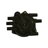 Top-down view of distributor cap exterior showing circular dome profile, numbered HT lead towers 1–6 around perimeter, retaining arm bracket with two brass screws, and central coil tower