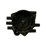 Interior underside of cap showing central carbon brush on spring post, six brass internal contacts around the inner circumference, and moulded-in numbering; cap seated open for inspection