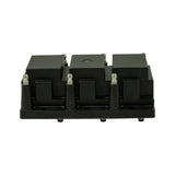Rear elevation of coil pack showing underside profile. Six LT connector pins visible along bottom edge of base plate. Three mounting foot stubs visible. Coil tower profile visible from rear.