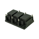 Isometric view from rear-left showing coil pack and mounting gasket. Three coil towers, six HT bullet terminals and six LT pins along base perimeter clearly visible. Two mounting holes visible on base plate flange.