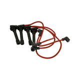 Full set of four red silicone ignition leads laid out, showing all four spark plug boots (straight, black rubber) and one right-angle distributor end cap. Leads appear unused and unpinched.