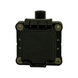 Top-down view of coil showing 3-pin connector bay with three exposed gold blade terminals, and HV tower boot from above. Mounting insert hardware visible at all four corners. Rear base retaining clip/tab visible.