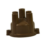 Front elevation of cap showing four HT towers and central coil tower. Two snap-clip mounting tabs visible at base rim. Brown phenolic body with no visible exterior markings.