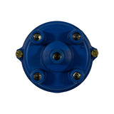 Underside view showing four evenly-spaced brass contact inserts and one central carbon brush contact in a cruciform-divided recess, confirming 4-cylinder configuration.