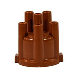 Alternate three-quarter angle showing all six lead towers from opposite side; base flange with clip tabs visible. Part appears uninstalled and in new condition with no carbon tracking or wear.