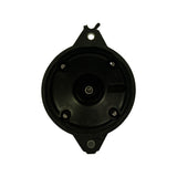 Underside of cap showing moulded cavity, central carbon brush post, and four spring-loaded terminal seats. Moulded text reads 'MADE IN JAPAN' with a date/batch code below it.