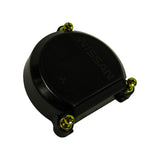 Three-quarter elevated view of distributor cap showing dome profile and three mounting lugs with brass/gold screws. 'NISSAN' text embossed on top surface. Mitsubishi logo visible. Black gloss/semi-gloss finish, no HT lead towers visible from this angle.