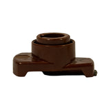 Front-on elevation of rotor arm showing symmetric stepped cylindrical hub, raised collar, and flanged base with two lower shelf tabs. Brass lateral contact tip just visible at right edge.