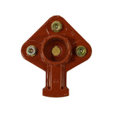 Underside view (cap-facing surface): central brass carbon-contact pip set in circular recess. Three brass contact terminals (flat discs with centre screw) arranged at cardinal points. Bosch roundel embossed on lower body stem. Moulded location ribs on stem.