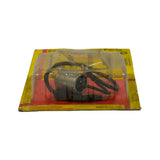 Reverse of blister pack showing the cylindrical metal-can condenser body with attached black insulated lead, MADE IN ENGLAND text along the bottom red stripe