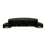 Edge view from the underside showing the brass pin terminals, mounting eyelets, and contact pads along the bottom of the housing