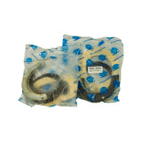 Close-up of the two Terrain Tamer branded poly bags, each labelled MSZ 5550 (REPL FSU-090A-1), contents visible through packaging as large annular rubber seals with a felt wiper seal and what appears to be a hub gasket.
