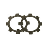 Two castellated steel lock rings (bearing retainer/tab washers) overlapping for scale. Each shows eight evenly spaced radial tabs around the perimeter used to lock the swivel hub nut.