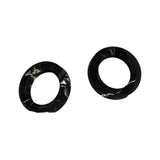 Two domed black rubber seals (hub grease seals) shown side by side, slightly angled to show the lip profile. Larger outer diameter than the flat seals in photo 6.