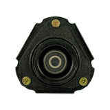 Top-down view of strut mount upper face showing triangular black rubber-bonded housing, central recessed bearing well, and three evenly spaced mounting studs at corners.