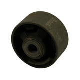 Angled 3/4 view from sleeve side, showing TENACITY and batch code on barrel at right, flanged bore end in foreground. Confirms single-piece rubber-metal construction.