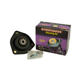 Wider shot showing the box (Strut-Mate Mounting Kit branding) alongside the loose mount and hardware bag — illustrates packaging and contents together.