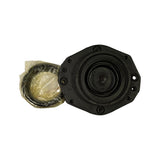 Underside of the strut mount housing with the central pressed-steel spring seat visible, showing the through-bore for the strut piston rod and surrounding rubber-bonded mounting plate.