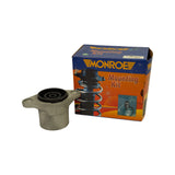 Mount displayed alongside its original Monroe Mounting Kit retail box with orange artwork showing a coil-over strut and suspension diagram