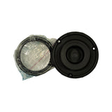 Top-down view of the strut mount cushion showing three perimeter bolt holes, central rubber dome with stud pass-through, and bagged bearing ring alongside