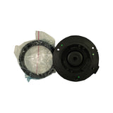 Underside of the strut mount showing recessed rubber bushing, central stud hole, mounting bolt seats, and green QC inspection paint dots; bearing ring in bag at left