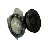 Angled side-by-side view of bagged bearing ring next to the strut mount showing the mount's domed rubber profile and integral metal flange
