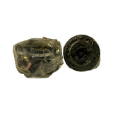 Same two components from a different angle; disc piece shown face-on revealing ring profile, left bundle shows partial view of joint body and hardware
