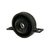 Three-quarter rear-angled view showing the serrated inner rubber face, central bearing race, and both mounting flanges — confirms single-piece moulded rubber-over-steel construction.