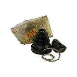 Kit laid out beside its bag: black rubber bellows-style CV boot standing upright, a crumpled black grease sachet, and one open-ear stainless steel clamp. NZCVs label with 'CVB328' partially visible on bag.