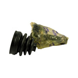 Side angle showing CV boot mated to the CV joint body still in poly bag; splined stub shaft tip visible protruding from bag top.