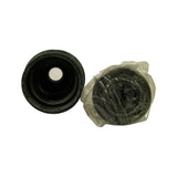 Top-down view of boot (left) showing inner bore and small retaining ring; outer CV joint body (right) still in plastic wrap showing grease-packed ball race from the large-diameter end.