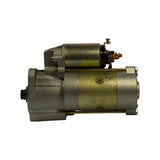 Opposite three-quarter view showing solenoid side with two copper stud terminals (B+ and S terminal) and field wire connector, and rear commutator end cap. Faint embossed markings visible on gold body band.