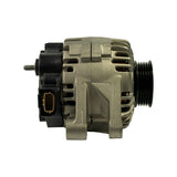 Right-side view showing the black rear plastic cover, tan/brown rectangular multi-pin wiring connector (Valeo-style), threaded B+ terminal stud on the upper left, and 6-groove black serpentine pulley on the right. Silver alloy mid-housing with ventilation slots and visible stator windings.